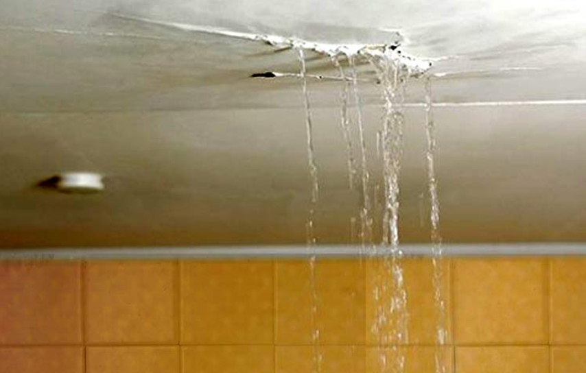 Rain water coming in a house from a roof leak.