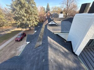 Photo view of top of roof that recently had roof maintenance done to improve the home's exterior