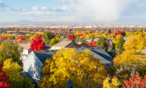 Colorado Living. Centennial, Colorado - Denver Metro Area Residential Autumn Panorama with the view of a Front Range mountains in the distance during the fall