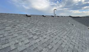 view of roof after a storm showing hail damage and ready to get a roofing estimate